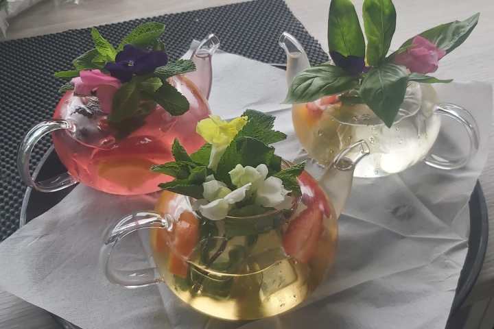 a vase filled with flowers sitting on a table