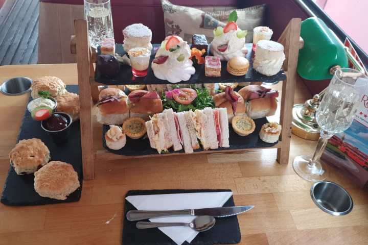 a bunch of food sitting on top of a wooden table